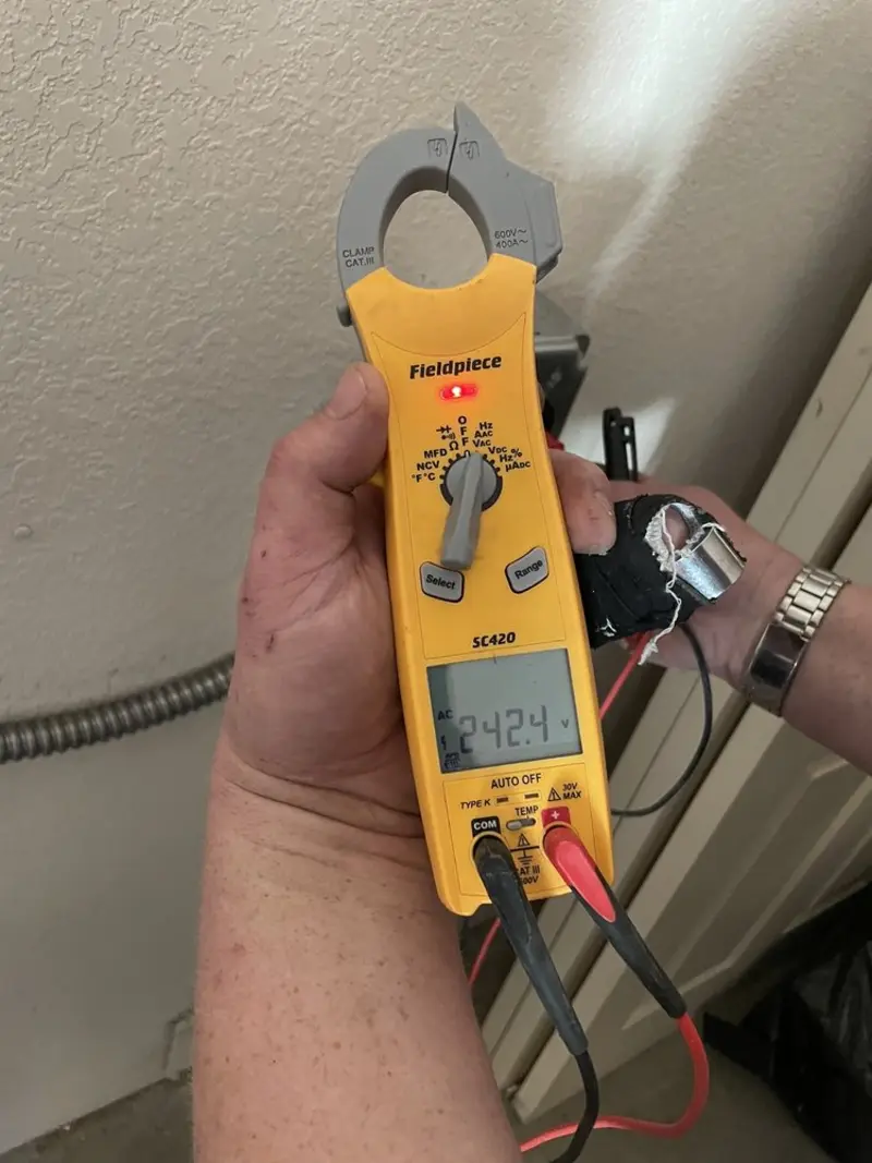 Voltage testing with clamp meter during Electrical Installation Services in Metamora